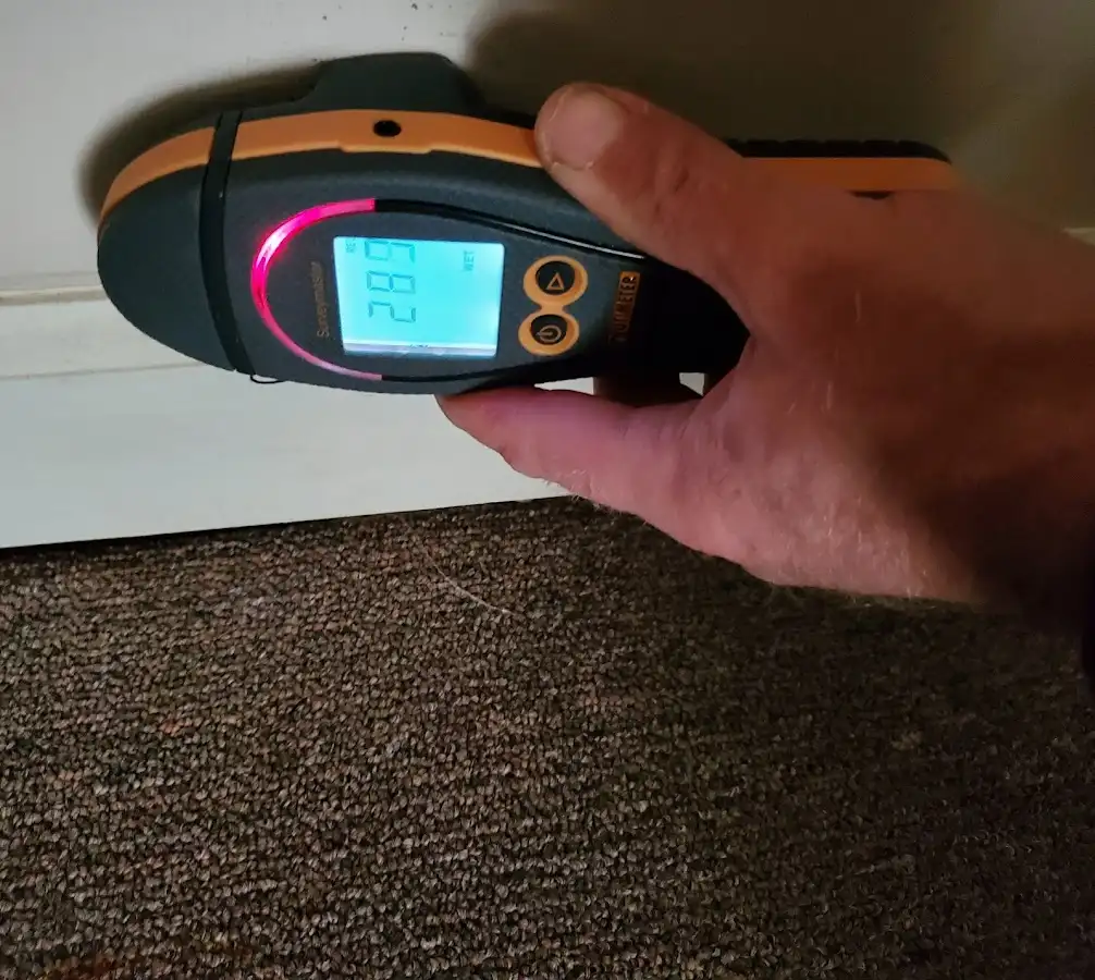 Moisture detection at baseboard during Storm Damage Restoration in Middletown